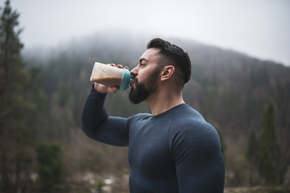 Man Drinking Protein Outside